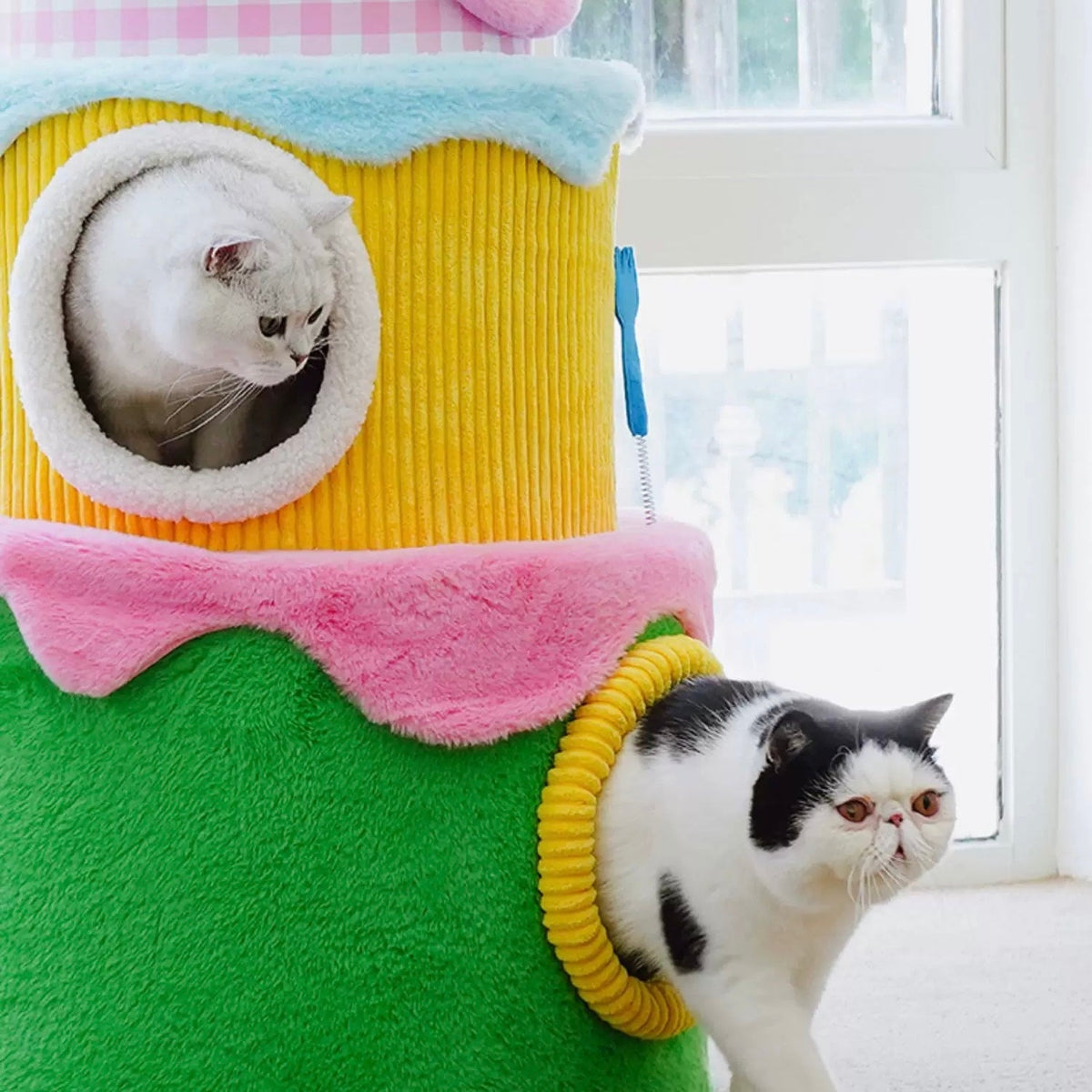 zeze three-layer cake cat tree in green, yellow and pink gingham with round hideaways and spring toys