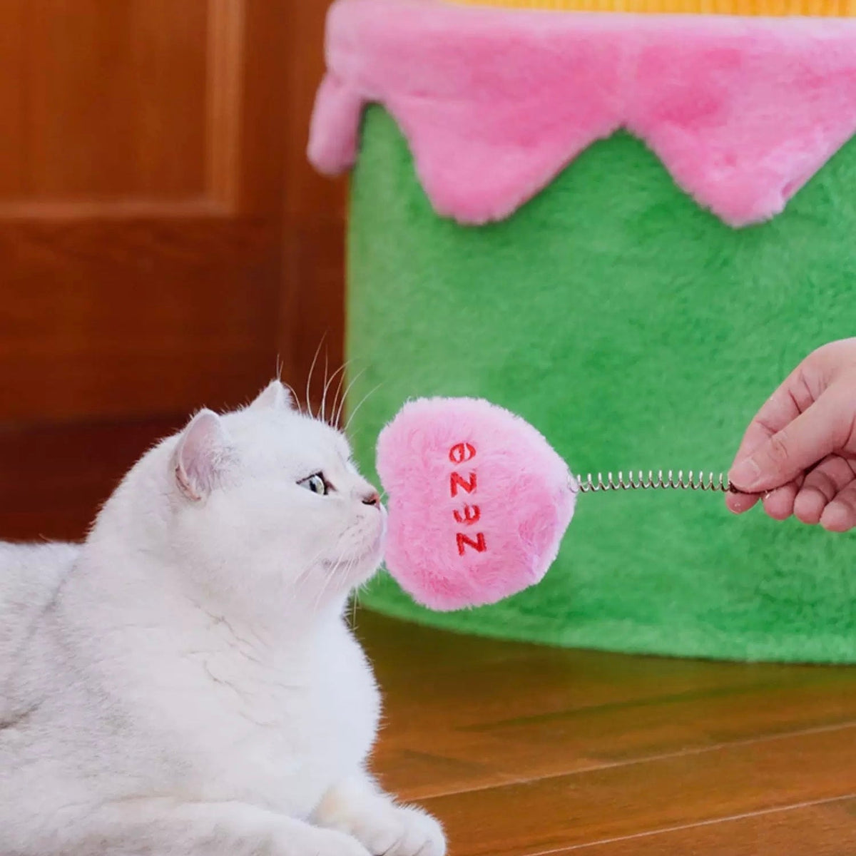 zeze three-layer cake cat tree in green, yellow and pink gingham with round hideaways and spring toys
