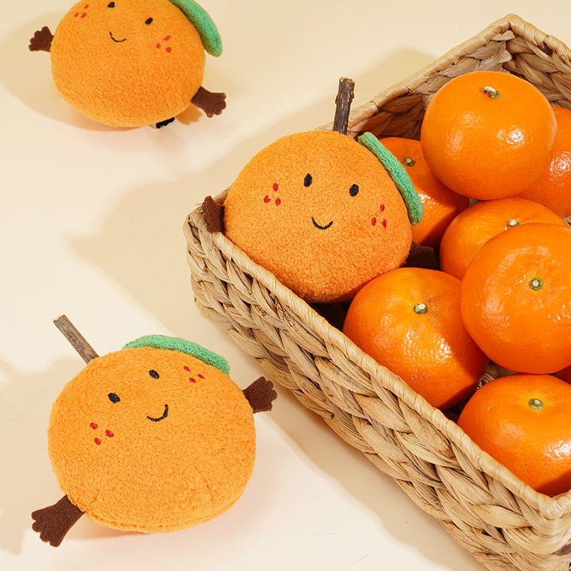 zeze plush orange cat toy with rosy cheeks, green leaf and a silvervine stick