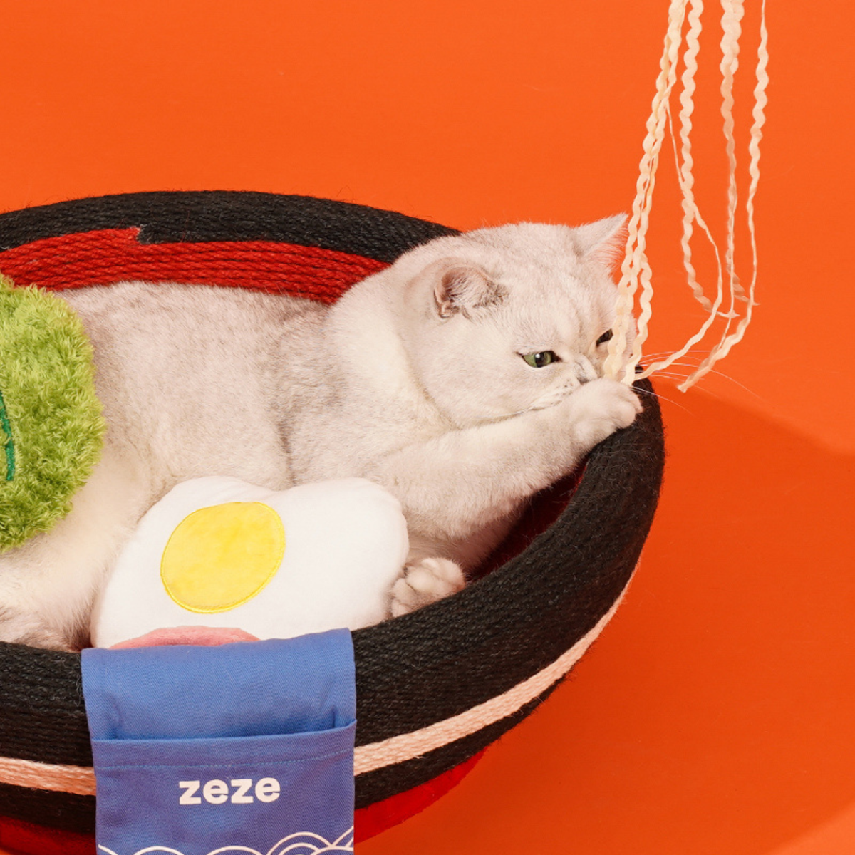 zeze big ramen bowl cat scratcher in black and red rope with plush egg, fishcake and chopsticks