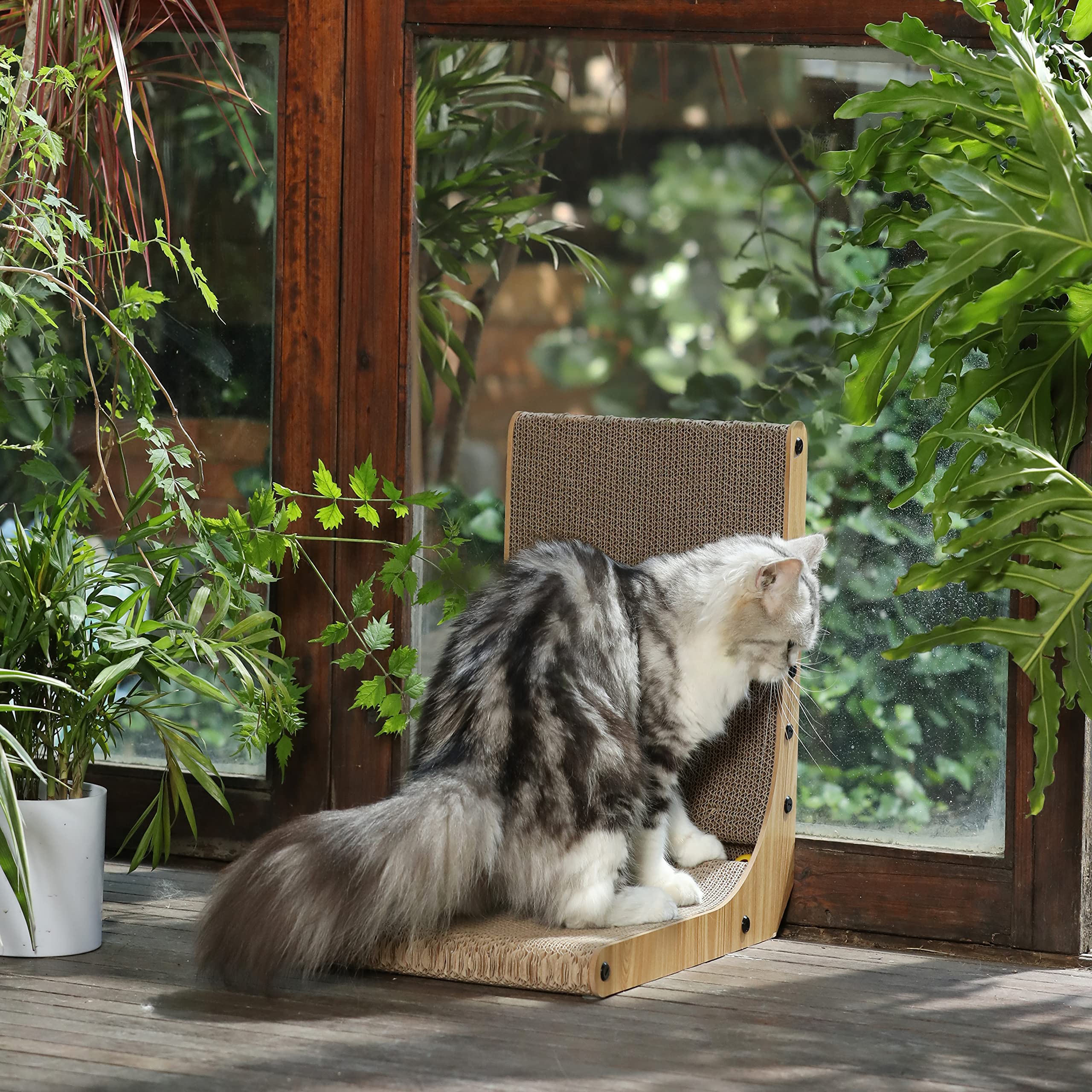 Wall mounted L-shape brown cardboard cat scratcher lounge with attached toy ball.