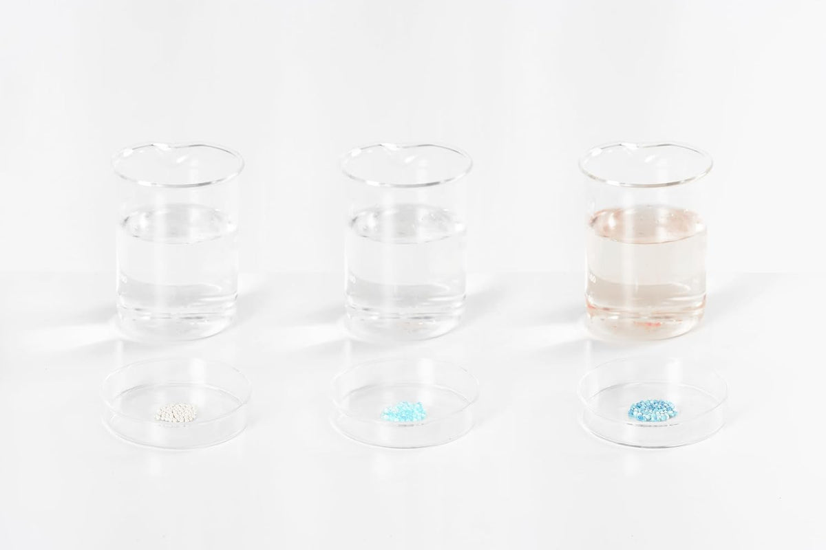 Three glasses showing the test particles' colour change