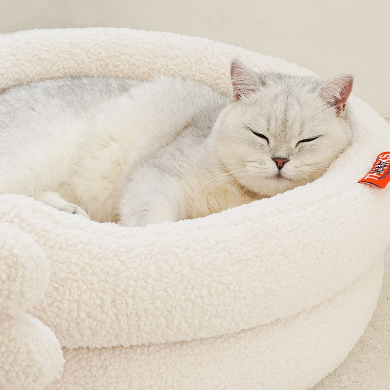 zeze Thank You Pet Bed: cream plush round bed with a large soft hand curled over the side