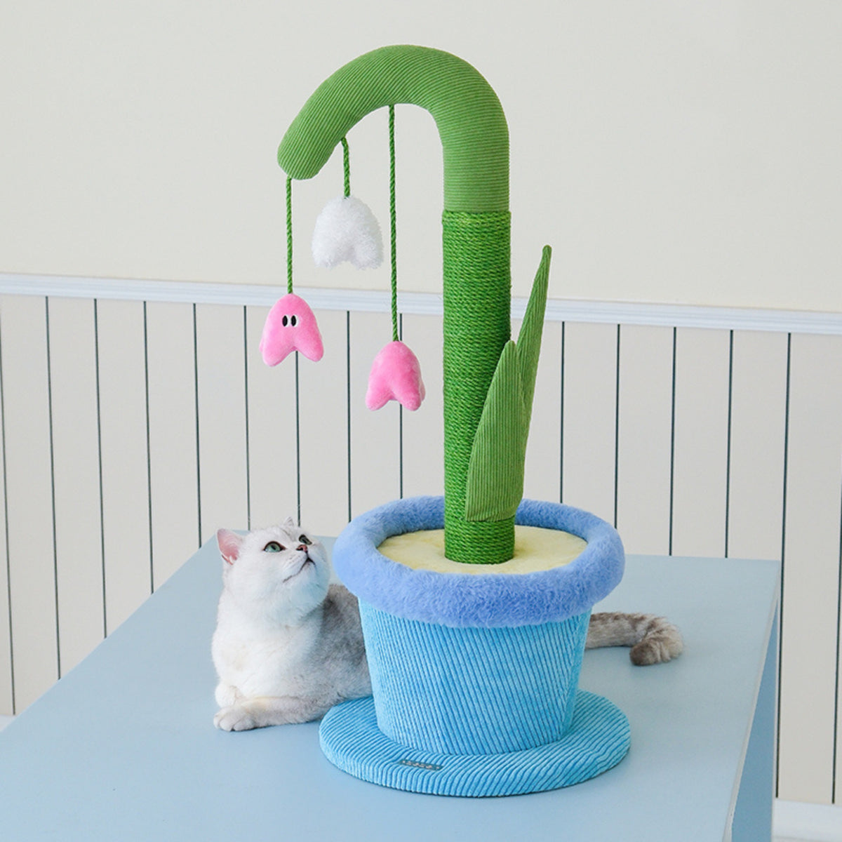 zeze Blooming Lily cat scratcher with a cat resting beside it