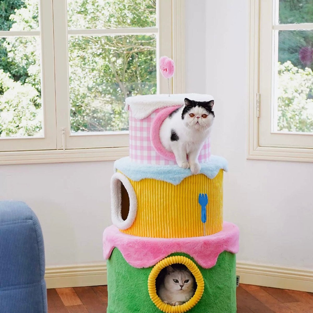 zeze three-layer cake cat tree in green, yellow and pink gingham with round hideaways and spring toys
