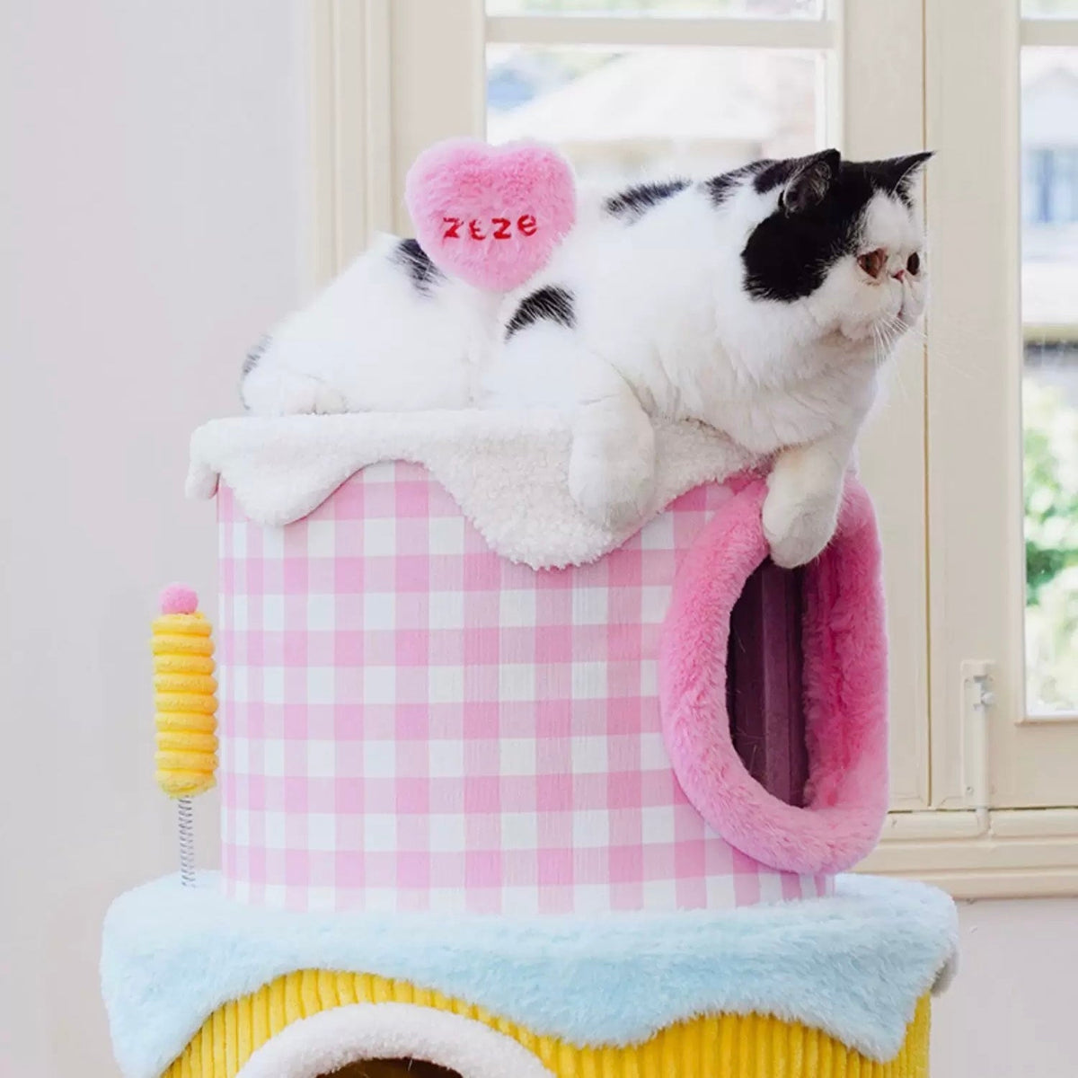 zeze three-layer cake cat tree in green, yellow and pink gingham with round hideaways and spring toys