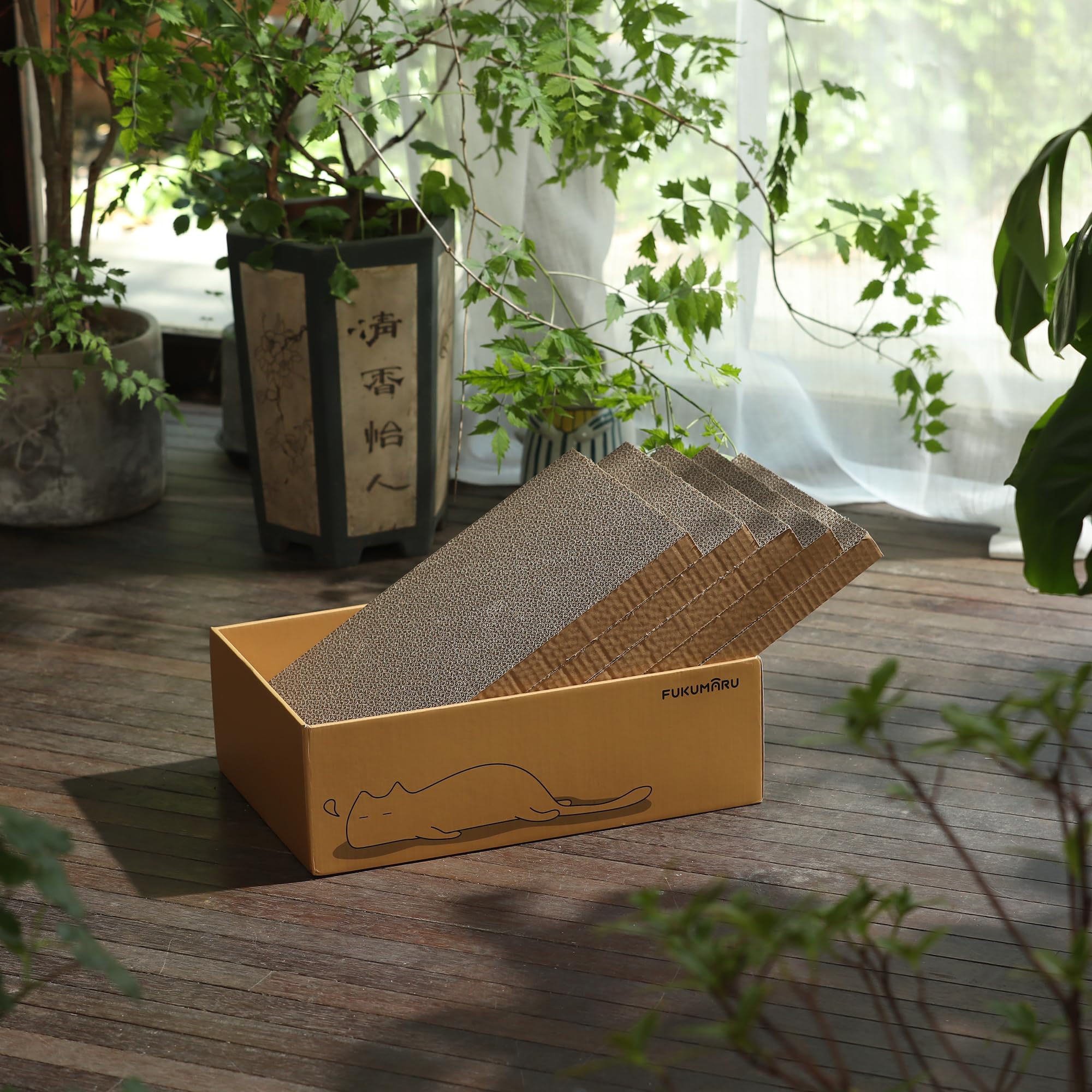 FUKUMARU scratcher box with cardboard refill pads in a home setting